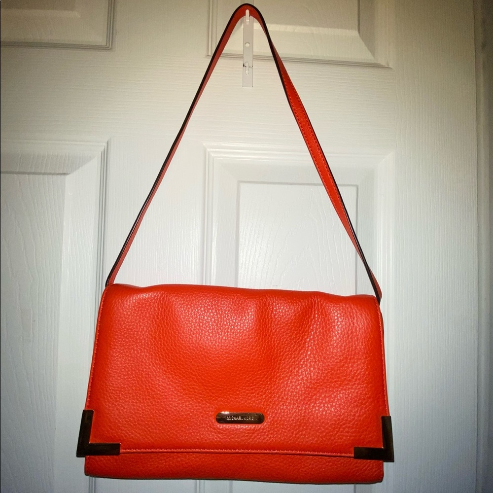 Michael Kors
large  leather clutch bag/ roomy